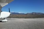 Cessna on panoramatic background. Notice snow caps on the mountains behind.
